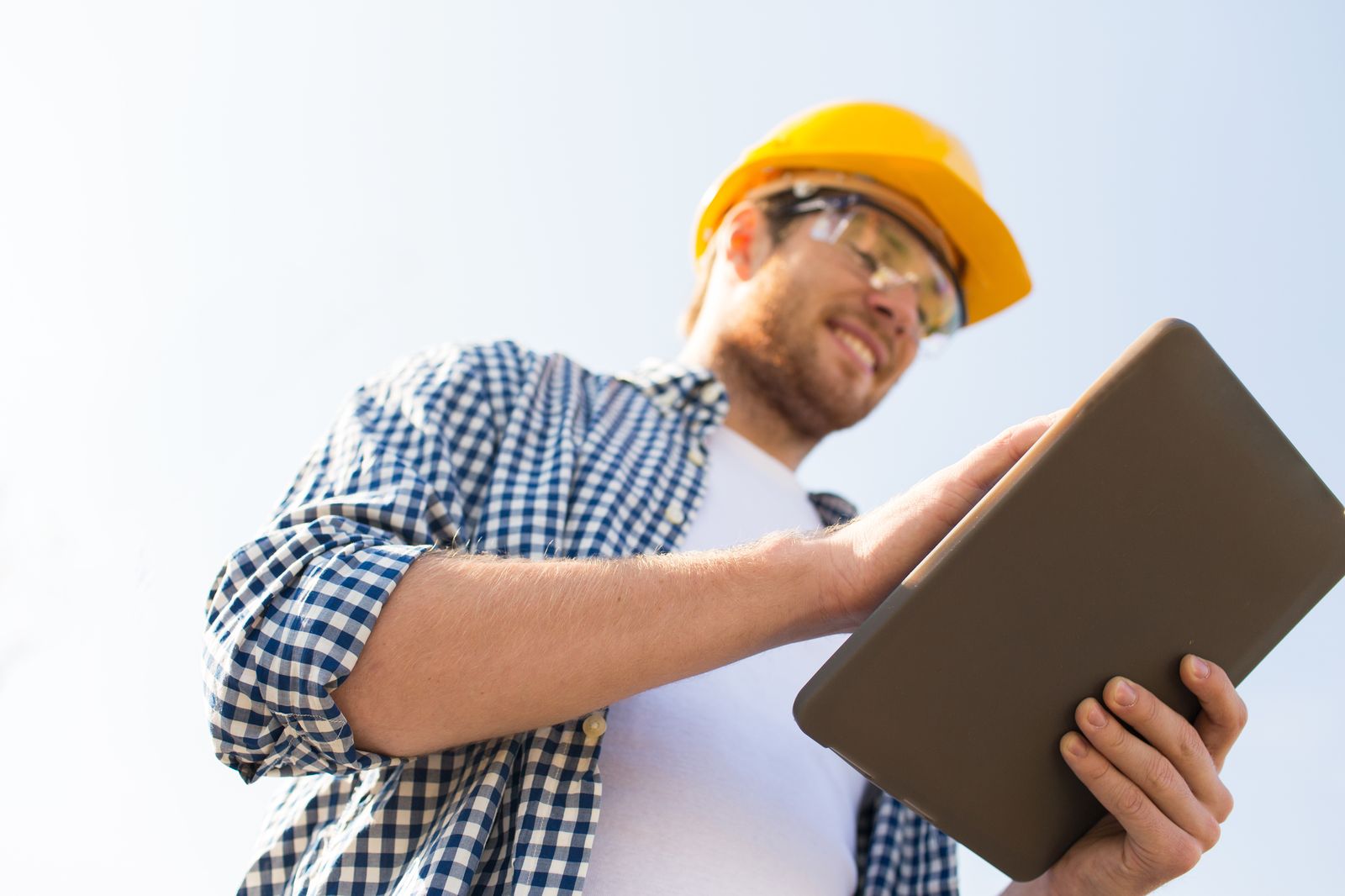 Contractor on a job site; replace with a photo of Christian on a roof